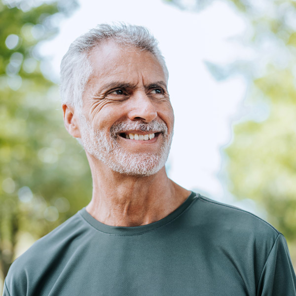 Portrait of a senior man on a workout in the public park